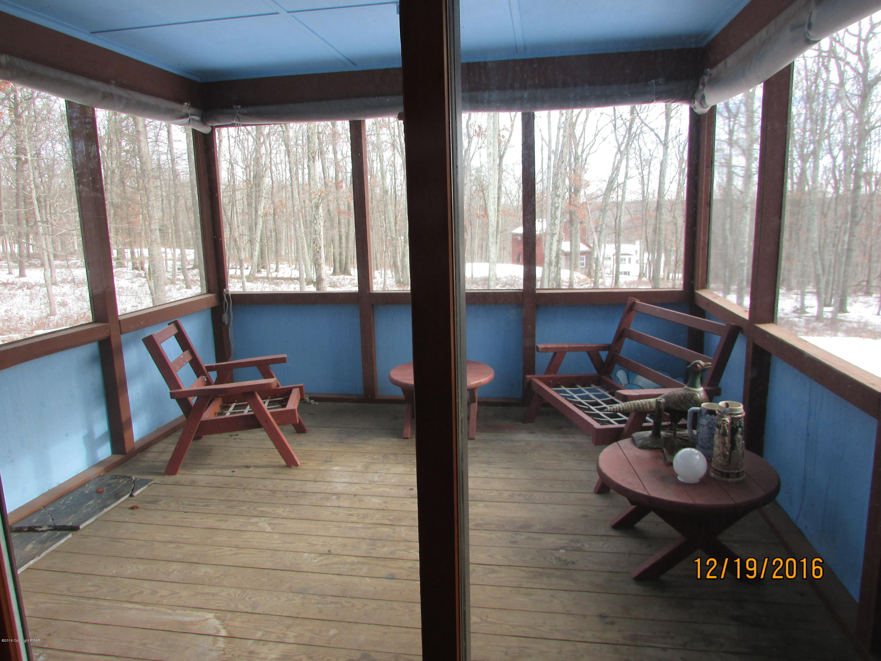 181 Doe Loop Bushkill, PA 18324 - Photo 9 of 34 181 Doe Loop screened in porch