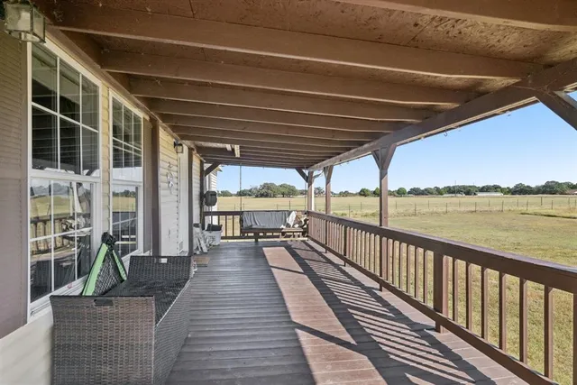 a view of a deck with wooden floor and outdoor space