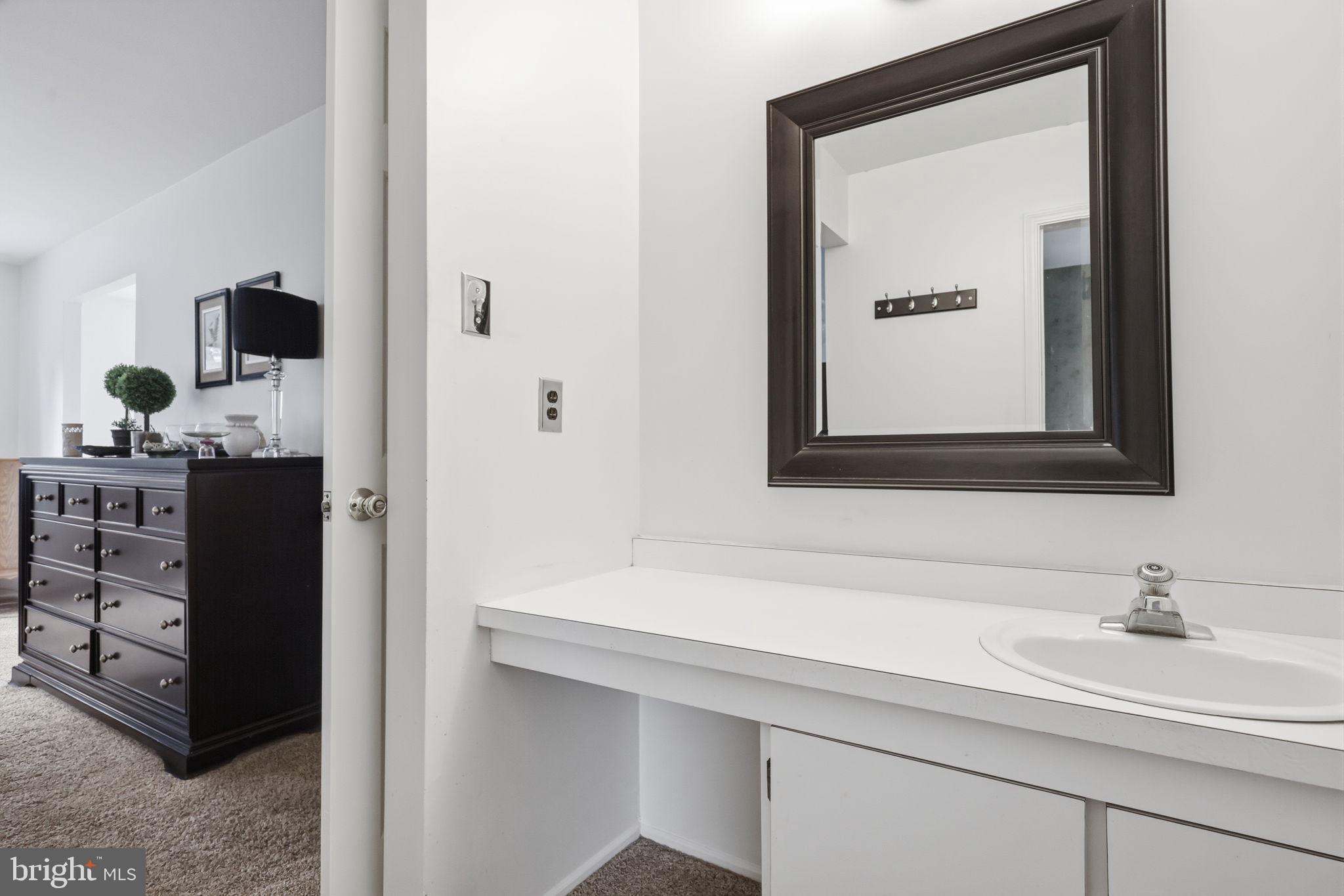 1140 Charter Road Warminster, PA 18974 - Photo 22 of 37 Sleek vanity with modern elegance.