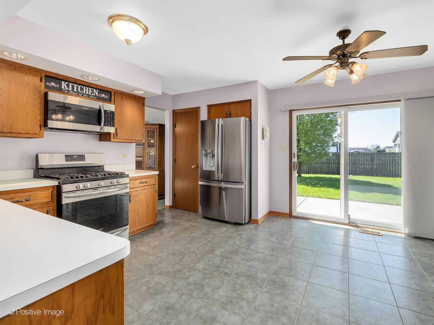 3235 192nd Street Lansing, IL 60438 - Photo 6 of 28 a kitchen with stainless steel appliances granite countertop a refrigerator a sink a stove and a refrigerator