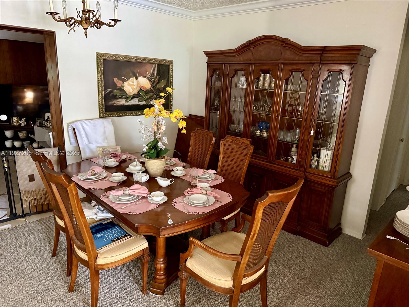 6341 Tamiami Canal Road Miami, FL 33126 - Photo 3 of 13 a view of a dining room with furniture and wooden floor