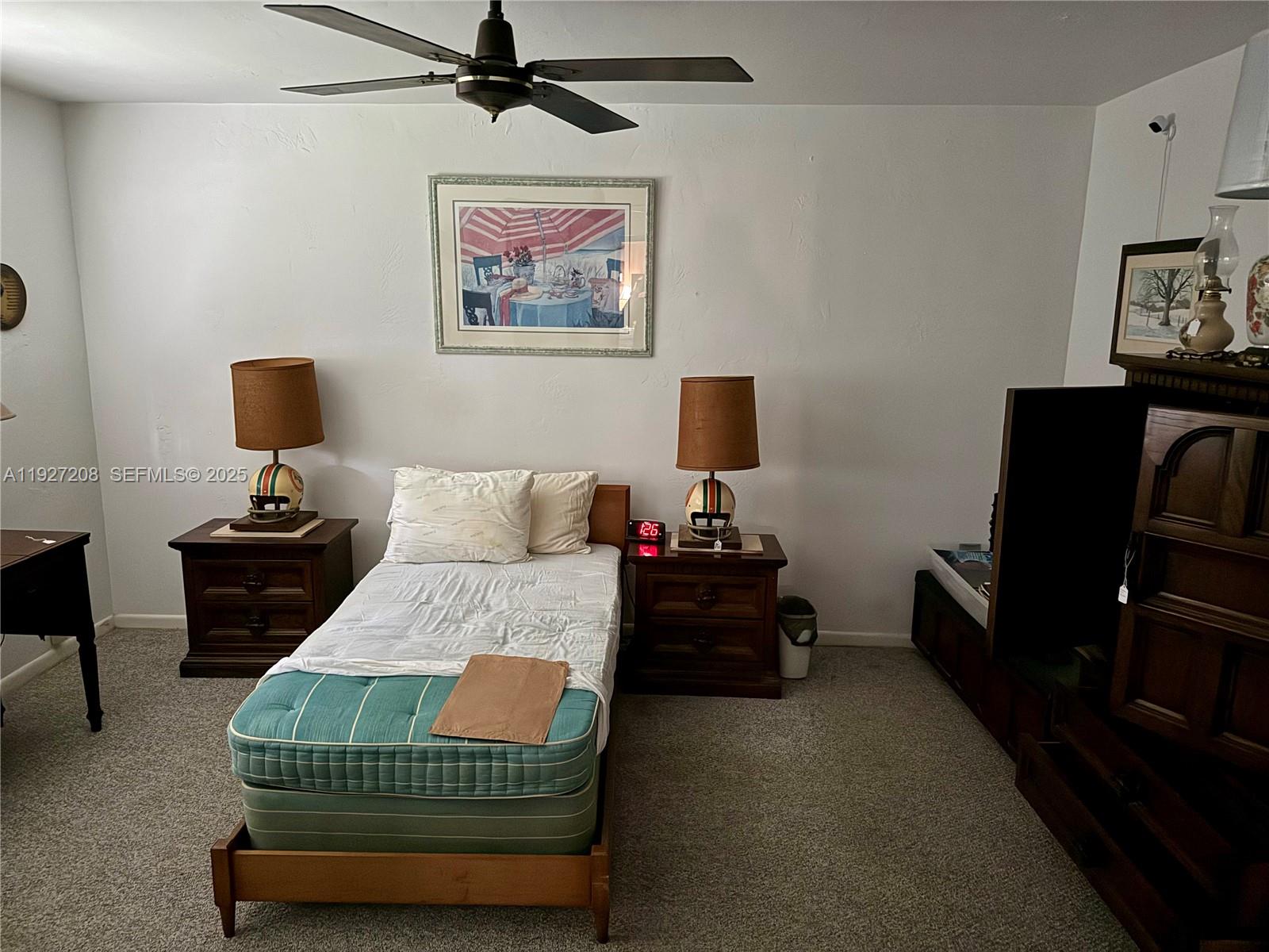 6341 Tamiami Canal Road Miami, FL 33126 - Photo 6 of 13 a bedroom with a bed and dresser