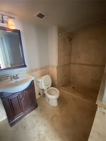 a view of hallway with wooden floor