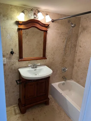 a bathroom with a sink and a bathtub