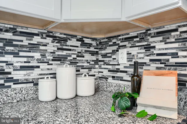 a kitchen with a stove and a refrigerator
