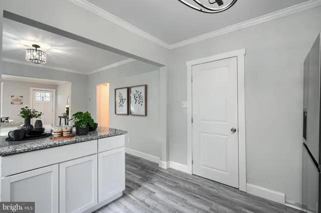 a kitchen with sink and cabinets