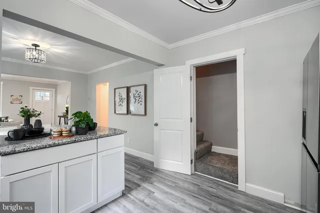 a kitchen with sink and cabinets