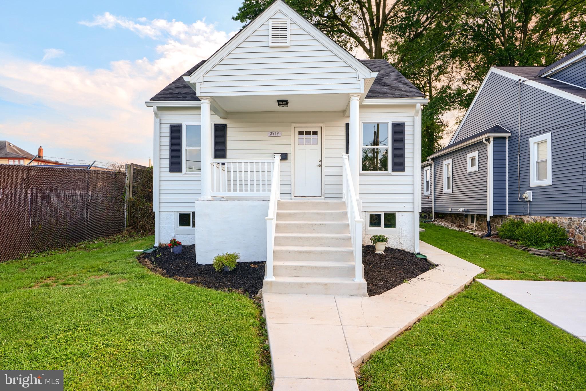2919 Onyx Road Baltimore, MD 21234 - Photo 2 of 41 a front view of a house with a garden