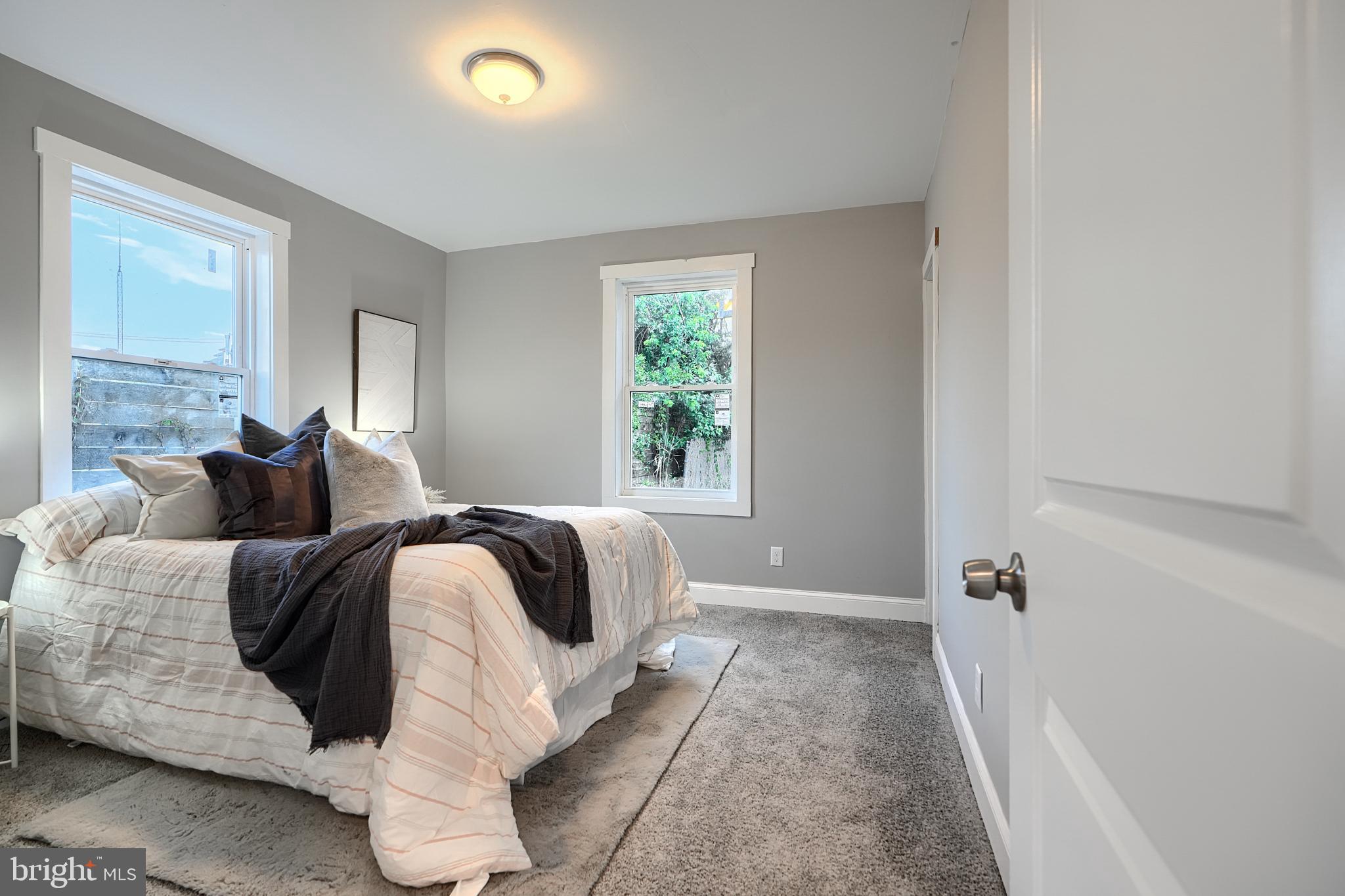 2919 Onyx Road Baltimore, MD 21234 - Photo 28 of 41 a living room with a bed furniture and a window