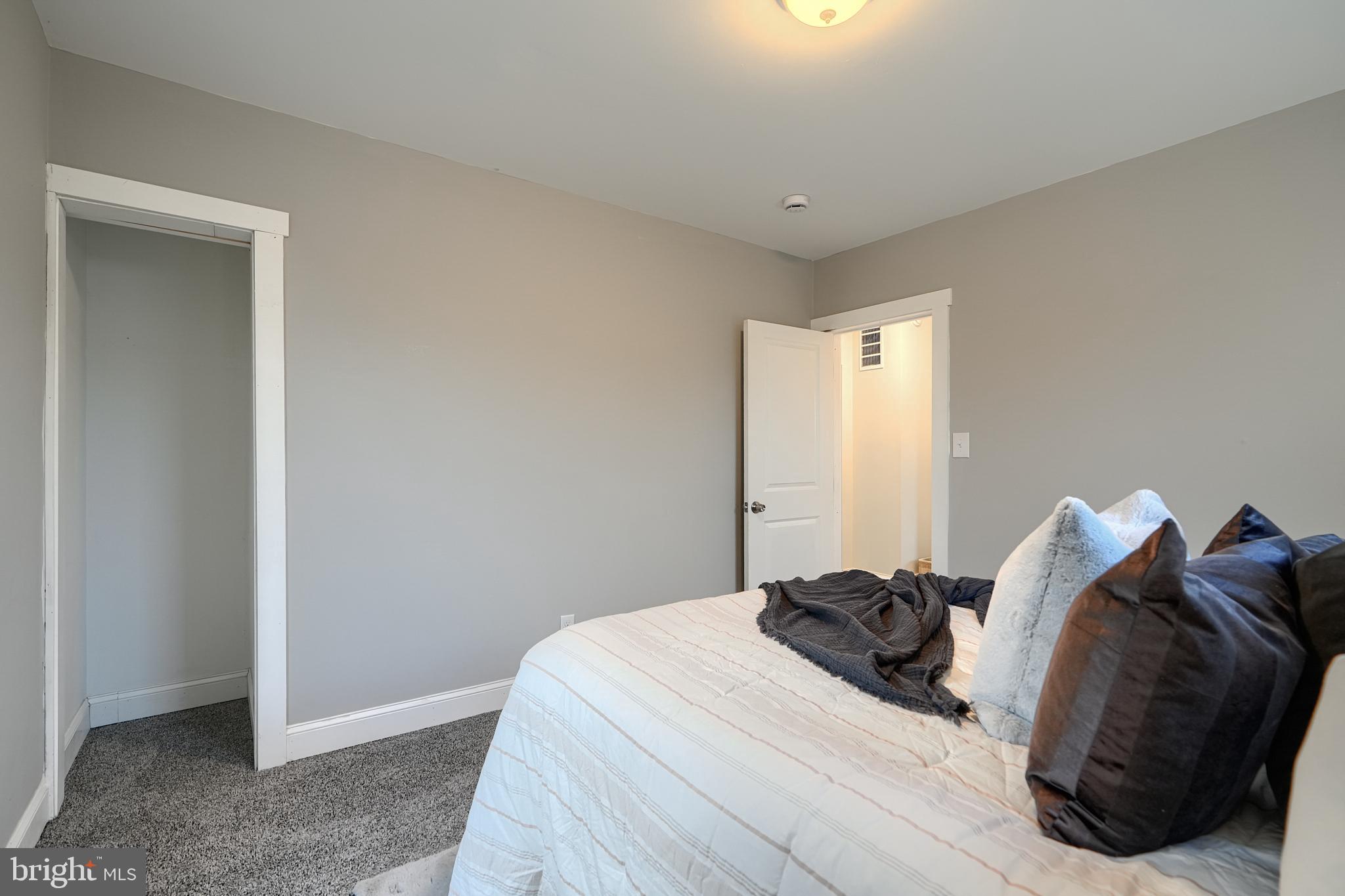 2919 Onyx Road Baltimore, MD 21234 - Photo 30 of 41 a bedroom with a bed and a window