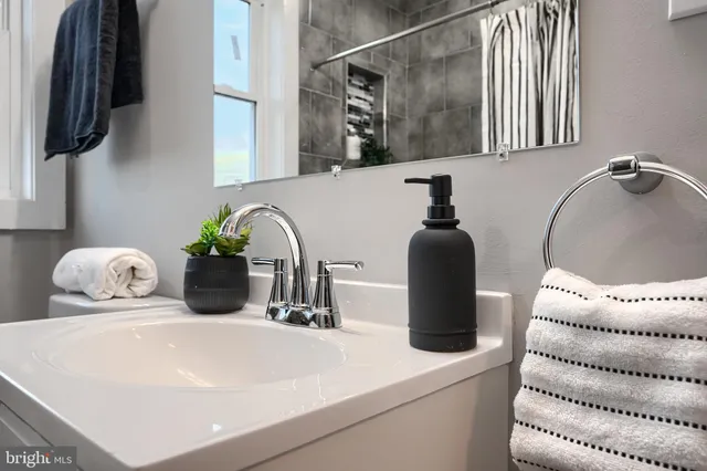 a bathroom with a sink and a mirror