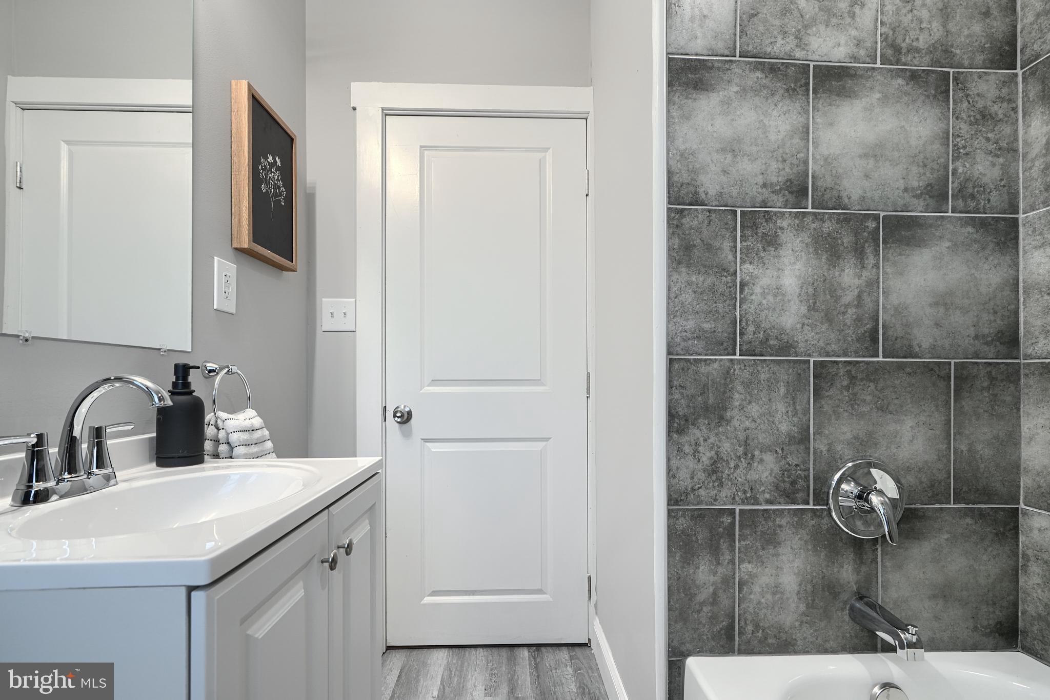 2919 Onyx Road Baltimore, MD 21234 - Photo 34 of 41 a bathroom with a sink and mirror