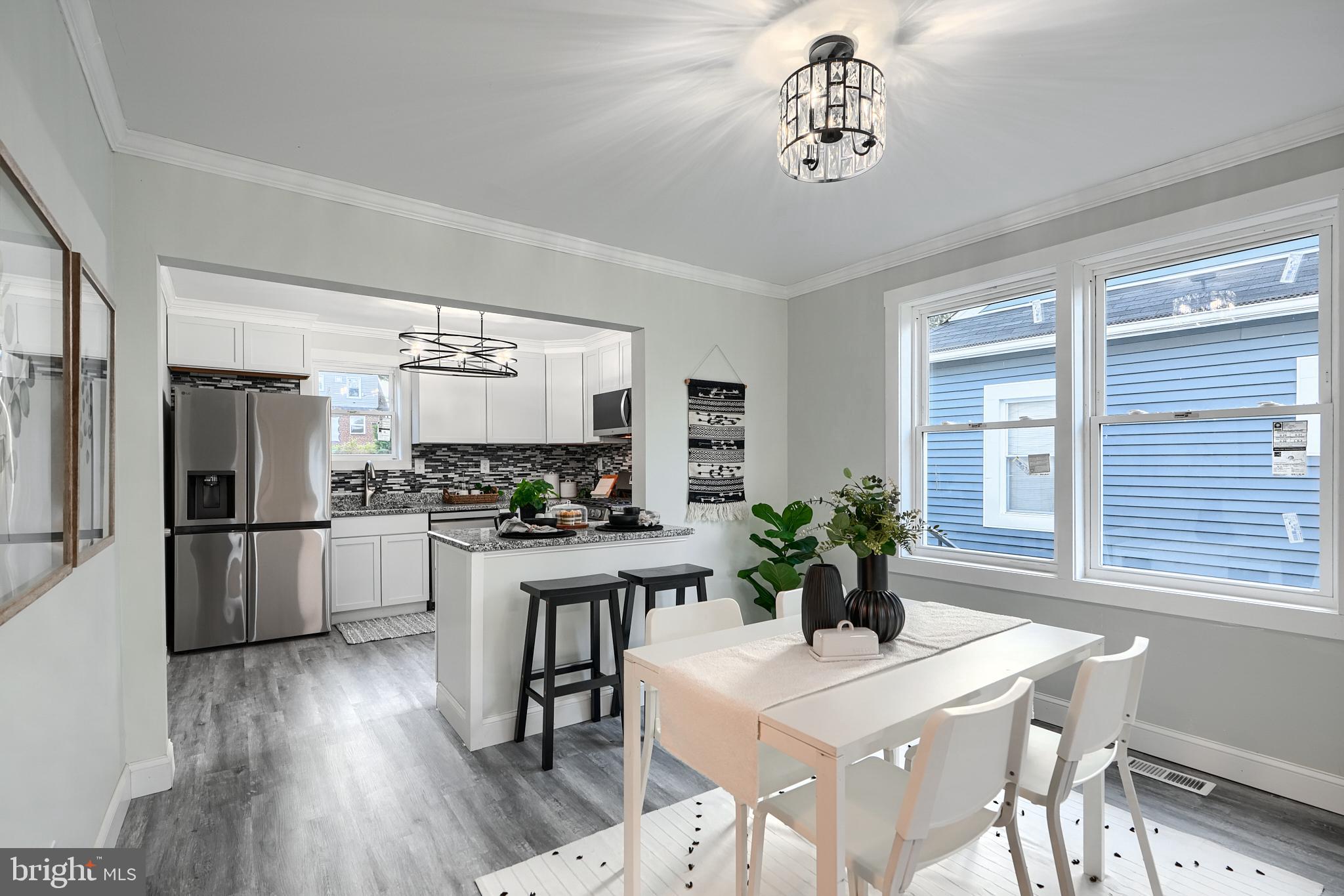 2919 Onyx Road Baltimore, MD 21234 - Photo 8 of 41 a dining room with furniture large window and wooden floor