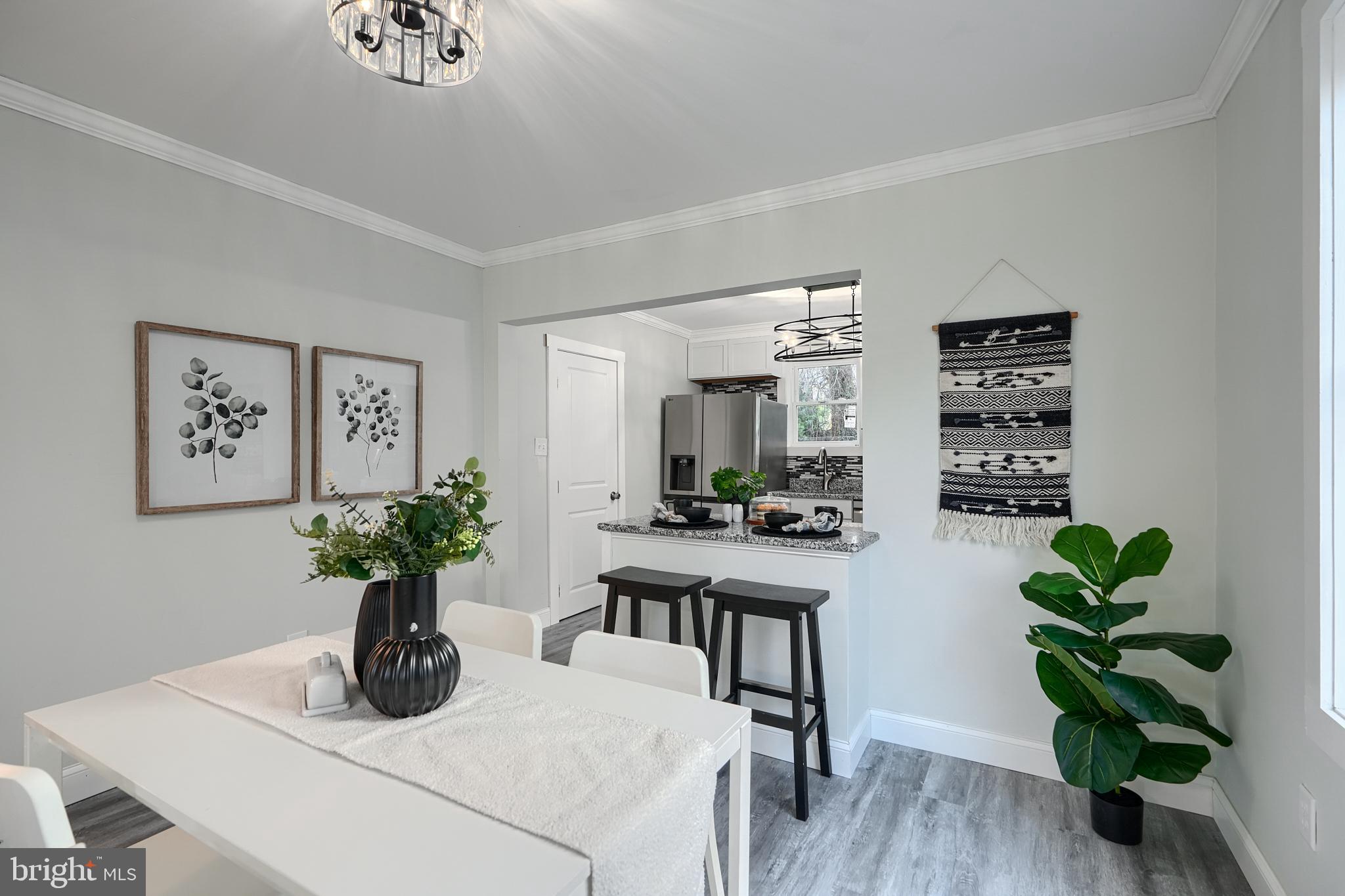 2919 Onyx Road Baltimore, MD 21234 - Photo 9 of 41 a dining room with furniture and potted plant