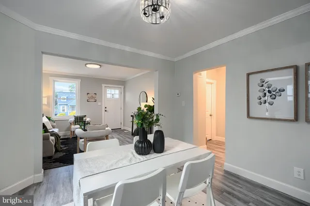 a view of a dining room with furniture window and flowerpot