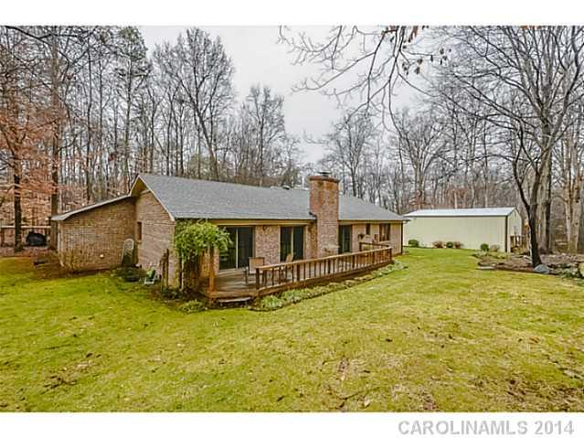 1611 Little Rock Road Charlotte, NC 28214 - Photo 13 of 16 a backyard of a house with table and chairs
