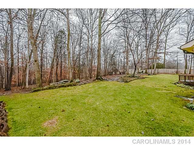 1611 Little Rock Road Charlotte, NC 28214 - Photo 16 of 16 a view of outdoor space with deck and trees