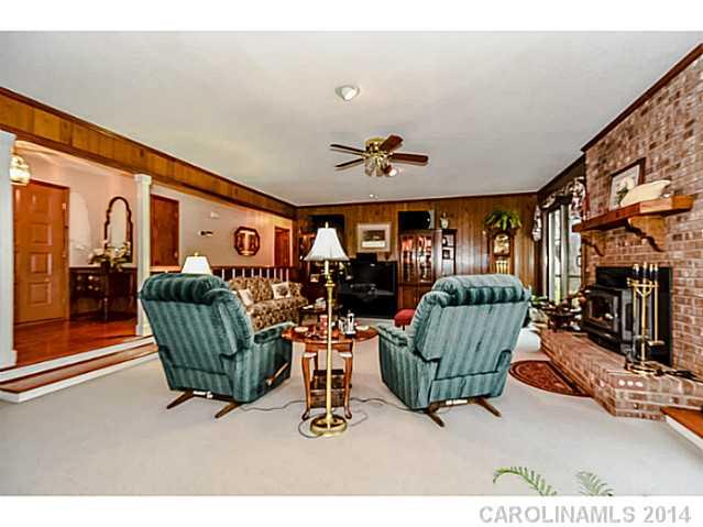 1611 Little Rock Road Charlotte, NC 28214 - Photo 5 of 16 a living room with furniture a rug and a large window