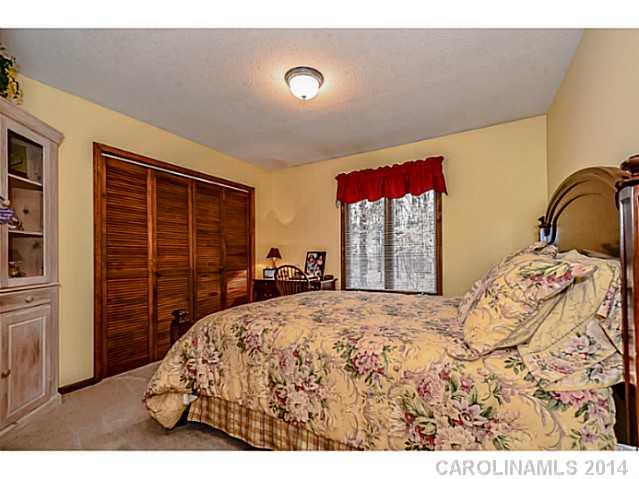 1611 Little Rock Road Charlotte, NC 28214 - Photo 10 of 16 a bedroom with a large bed and a window