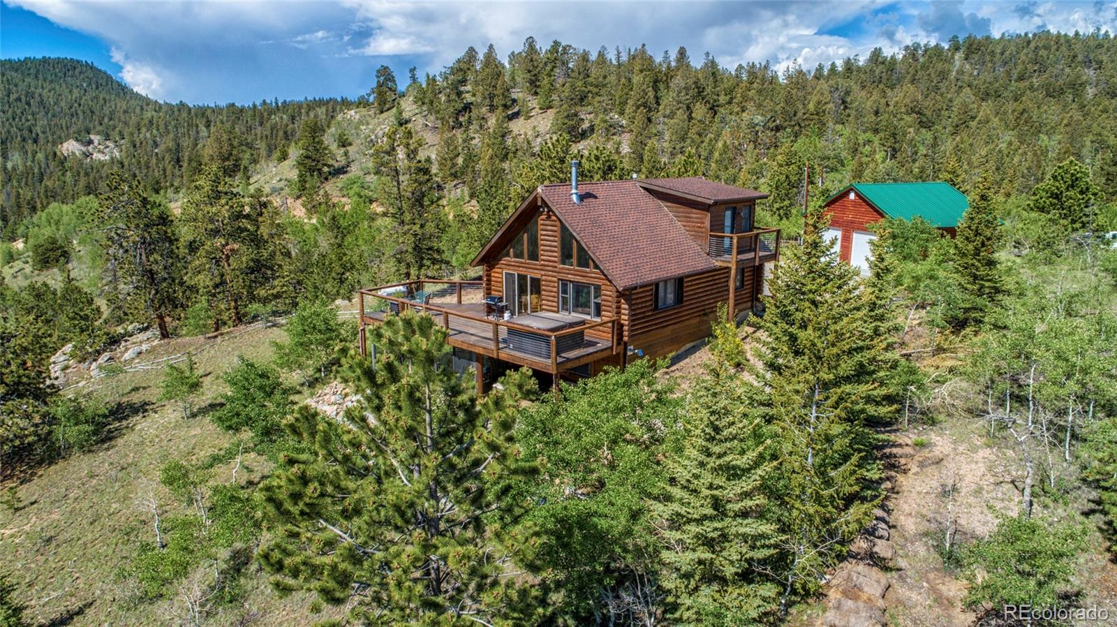 144 Red Cloud Road Como, CO 80456 - Photo 1 of 34 an aerial view of a house with a yard basket ball court and outdoor seating