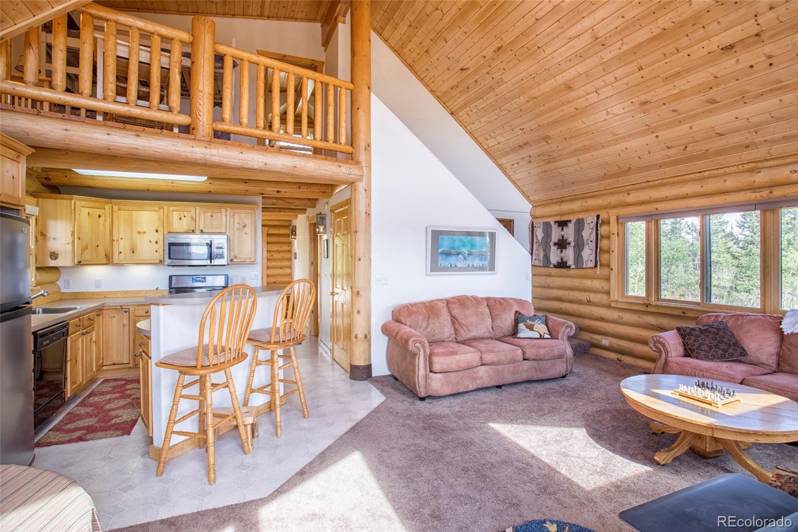 144 Red Cloud Road Como, CO 80456 - Photo 12 of 34 a living room with furniture and a table