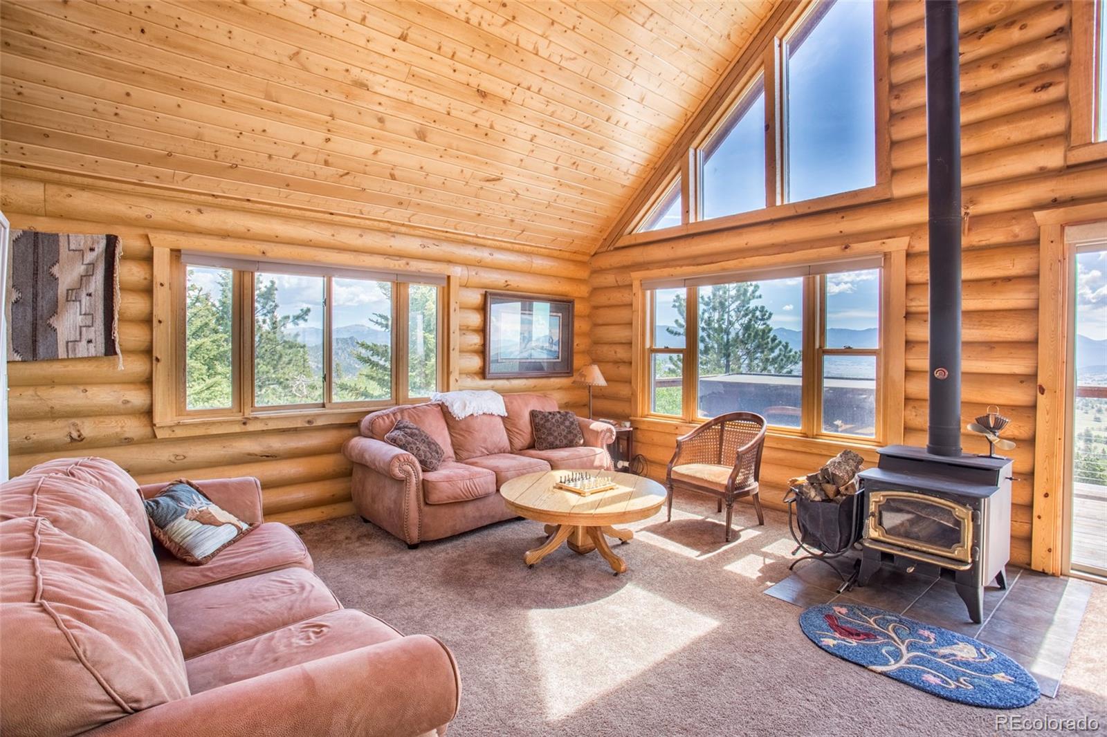 144 Red Cloud Road Como, CO 80456 - Photo 13 of 34 a living room with furniture and a large window