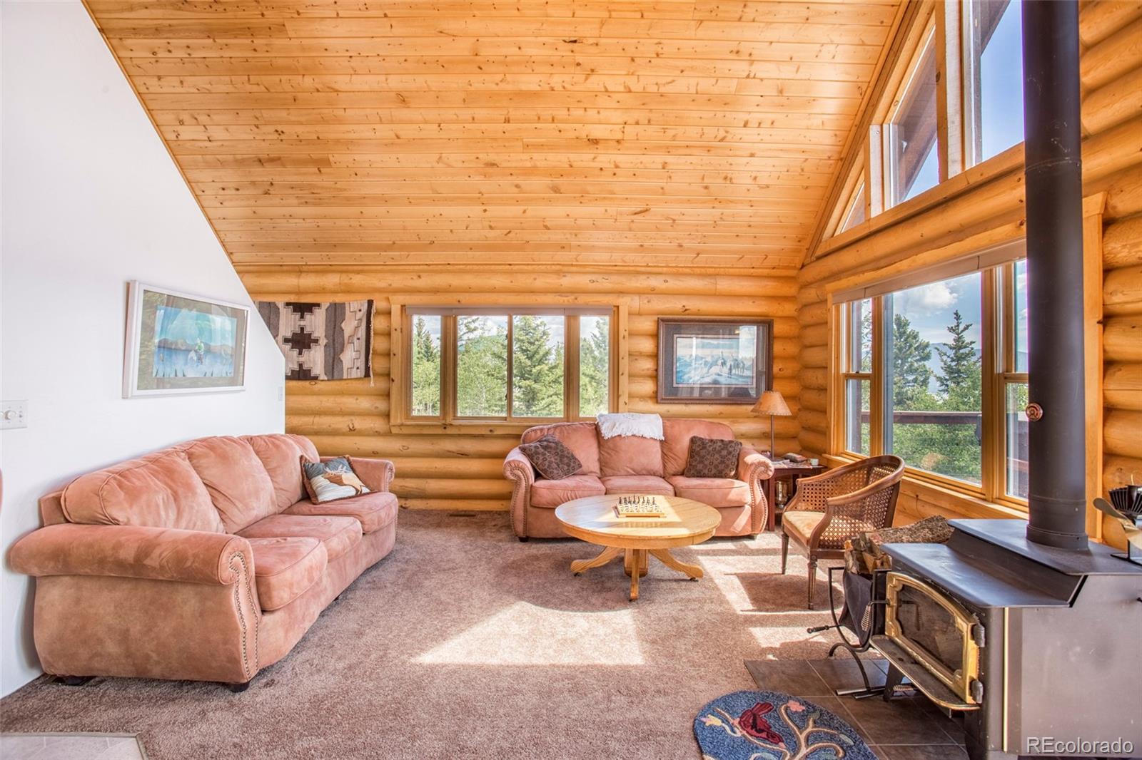 144 Red Cloud Road Como, CO 80456 - Photo 14 of 34 a living room with furniture and a floor to ceiling window