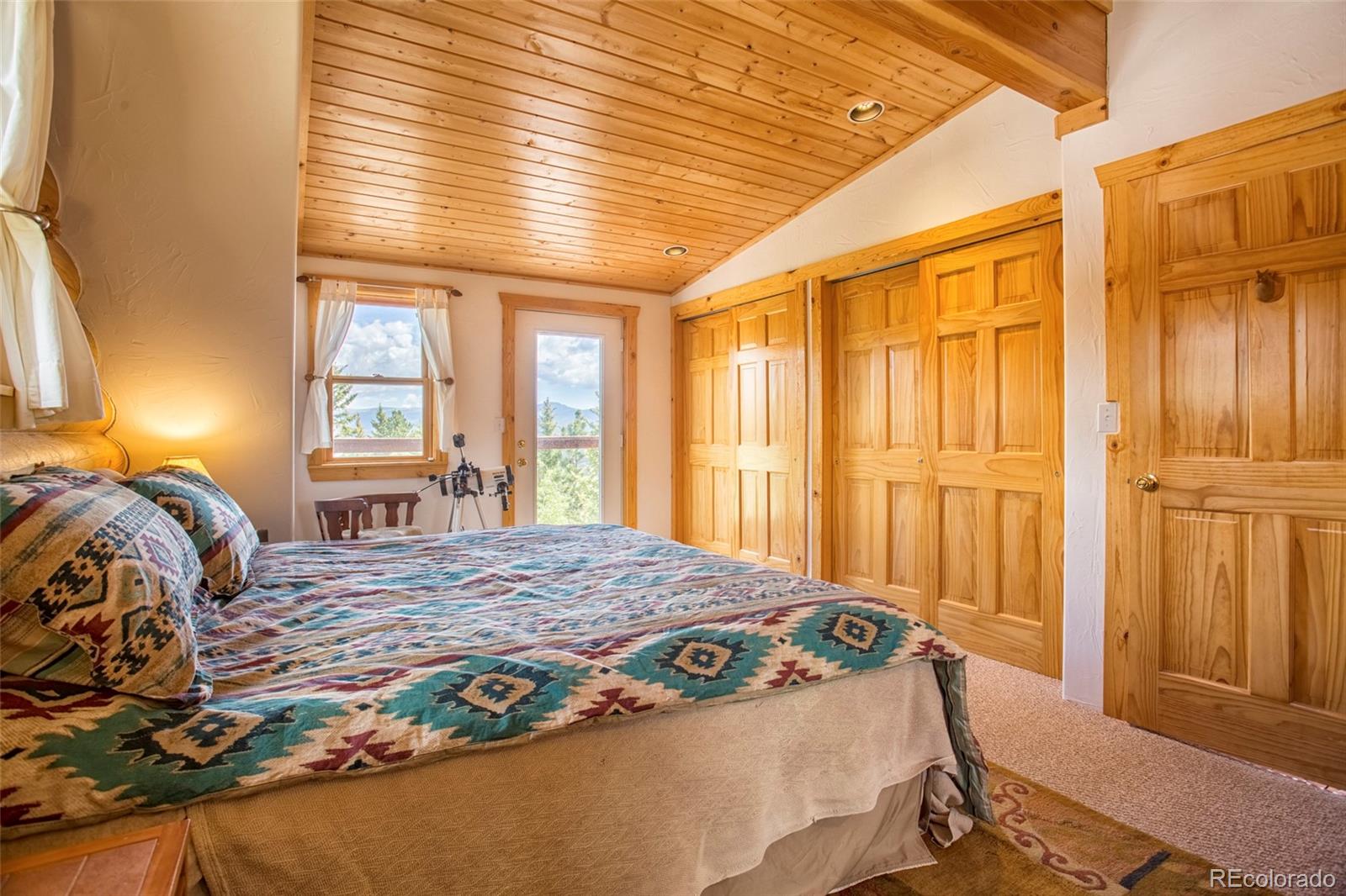 144 Red Cloud Road Como, CO 80456 - Photo 22 of 34 a bedroom with a bed and a window