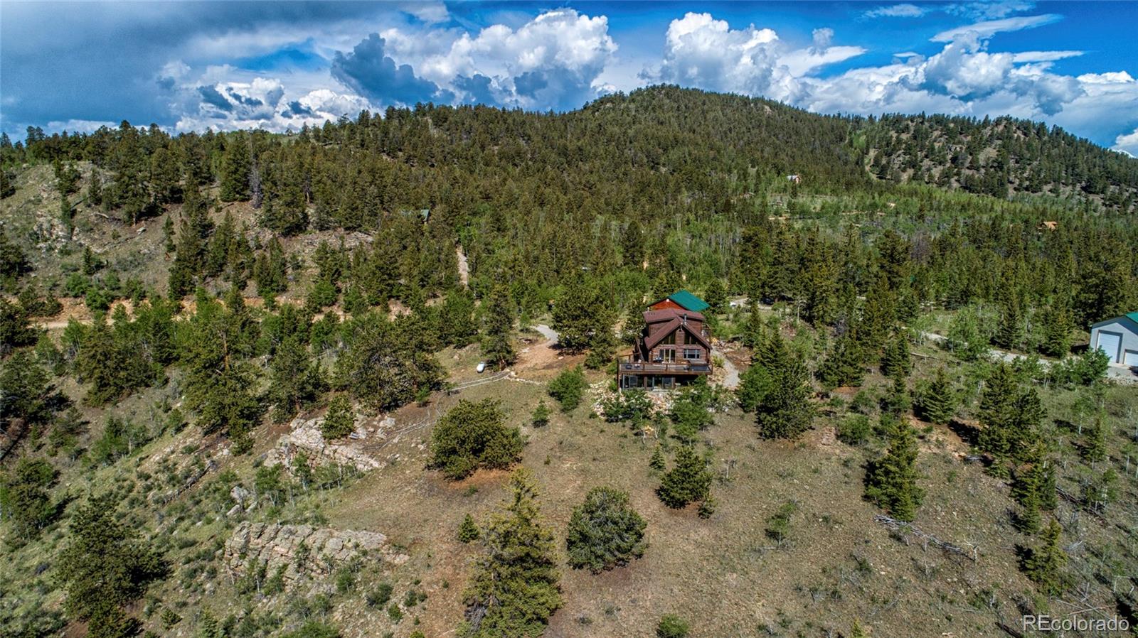 144 Red Cloud Road Como, CO 80456 - Photo 4 of 34 a view of a houses with a yard
