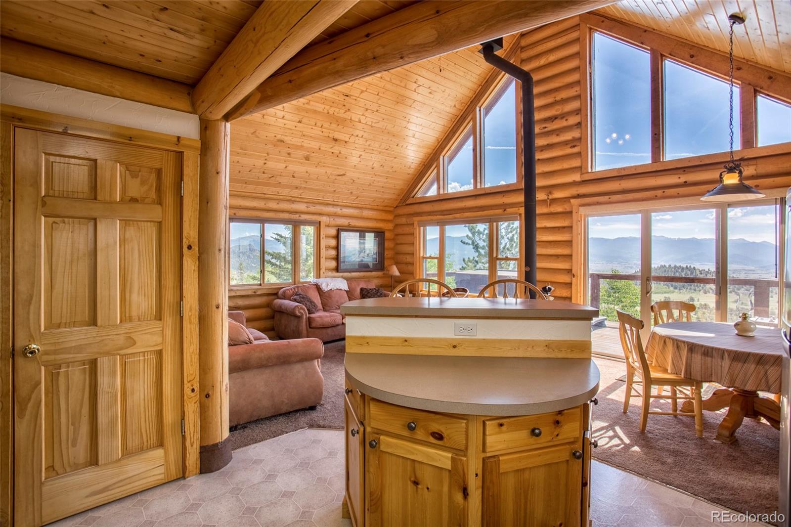 144 Red Cloud Road Como, CO 80456 - Photo 6 of 34 a view of a living room and kitchen area