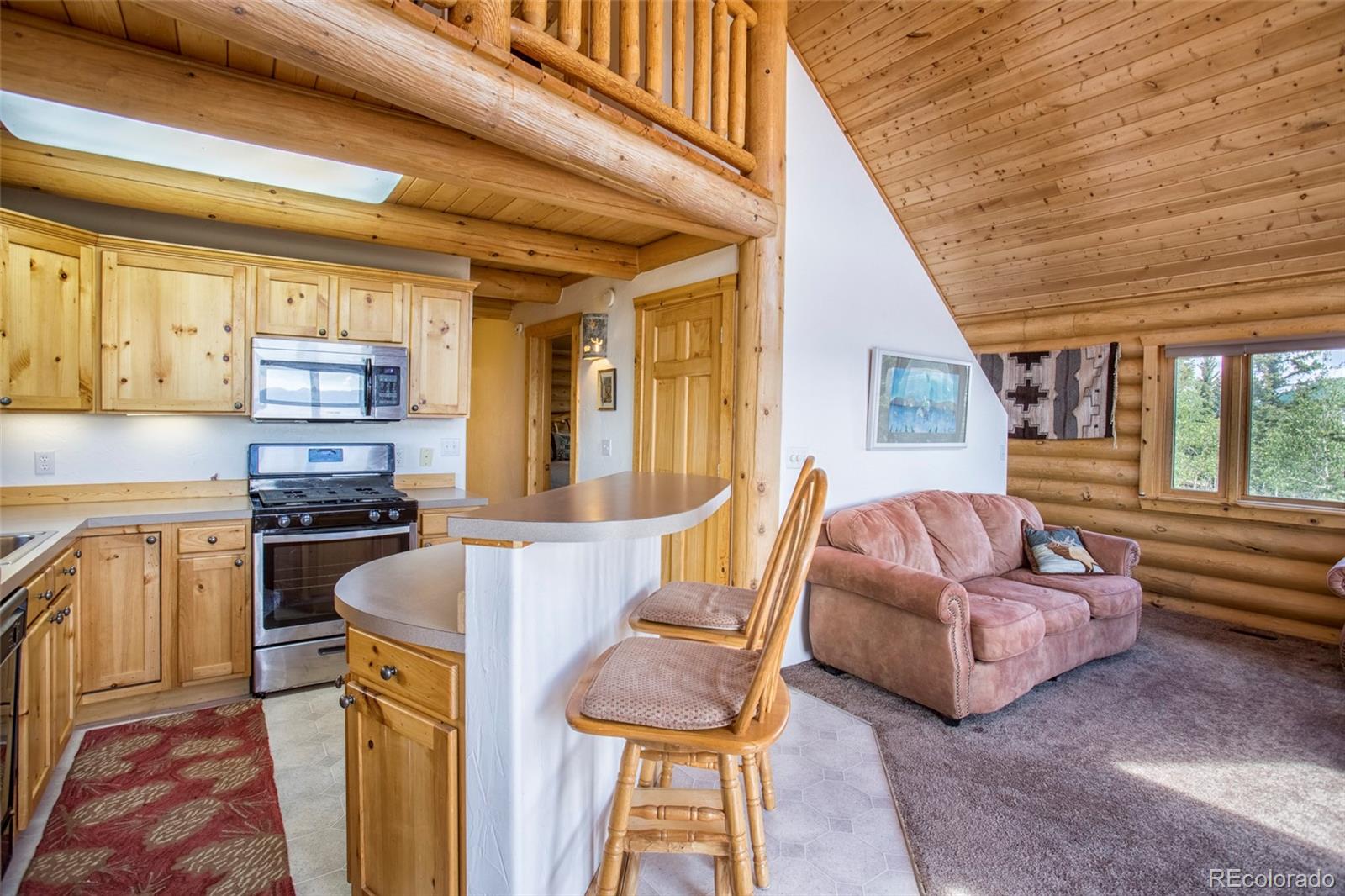 144 Red Cloud Road Como, CO 80456 - Photo 9 of 34 a living room with furniture and a open kitchen view