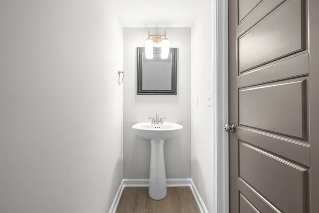 a bathroom with a sink and mirror