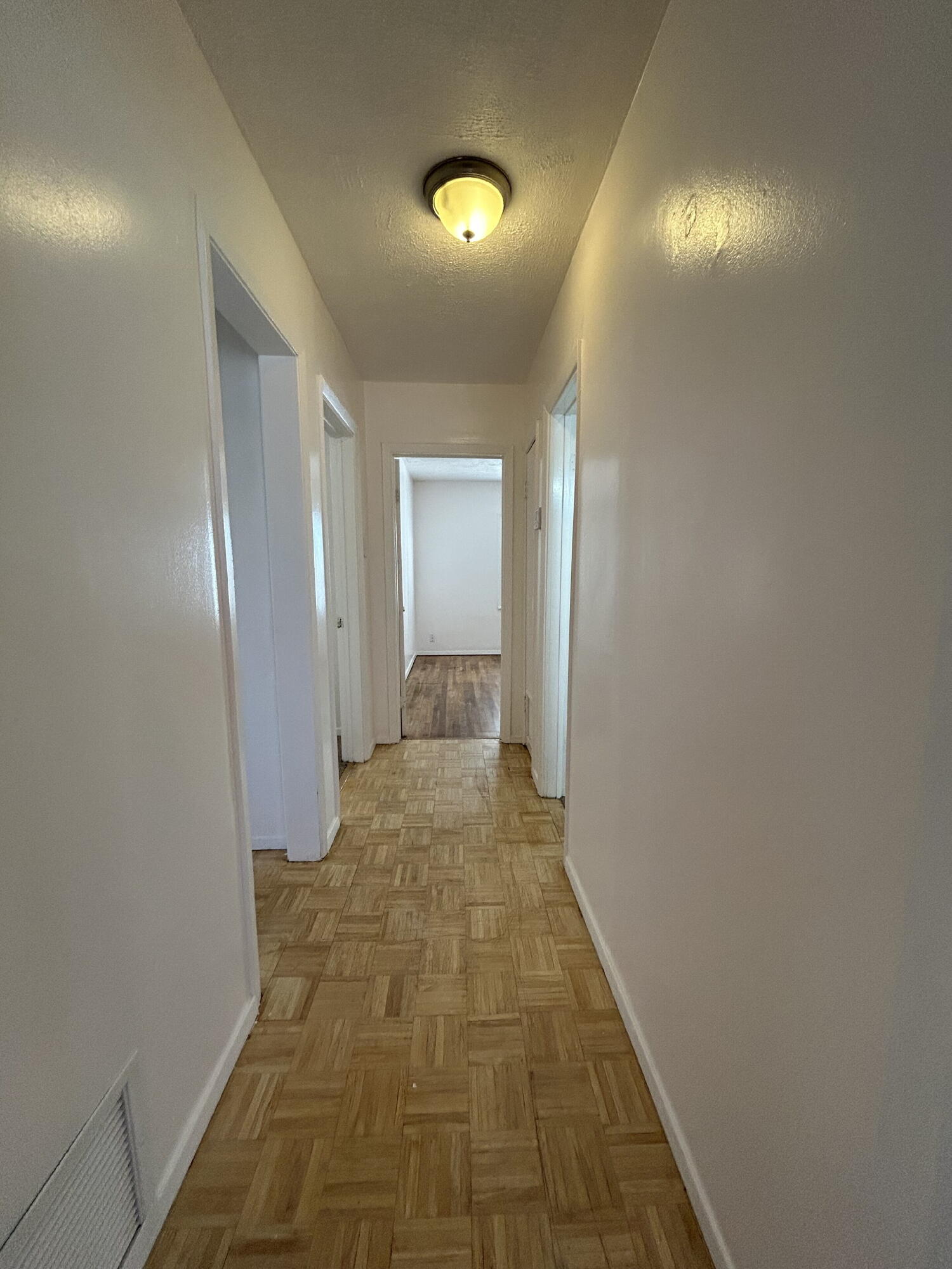 2201 28th Street, Unit FRONT Lubbock, TX 79411 - Photo 11 of 23 a view of a hallway with wooden floor