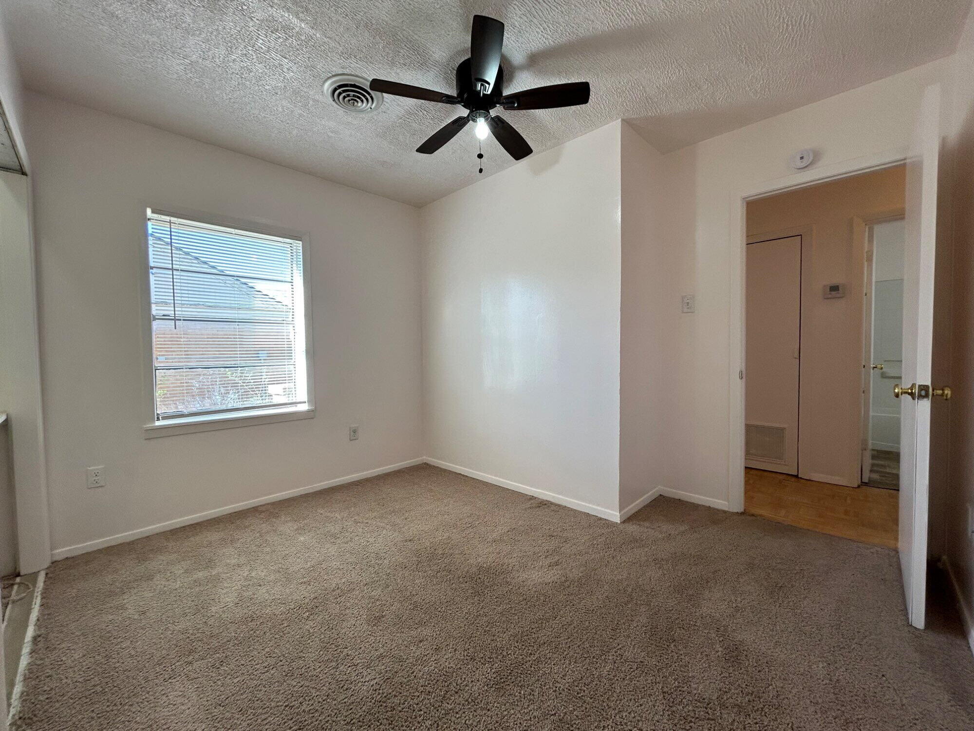 2201 28th Street, Unit FRONT Lubbock, TX 79411 - Photo 19 of 23 a view of an empty room with a window