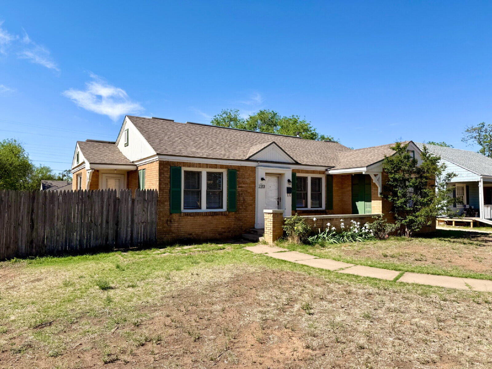 2201 28th Street, Unit FRONT Lubbock, TX 79411 - Photo 2 of 23 a front view of a house with a yard