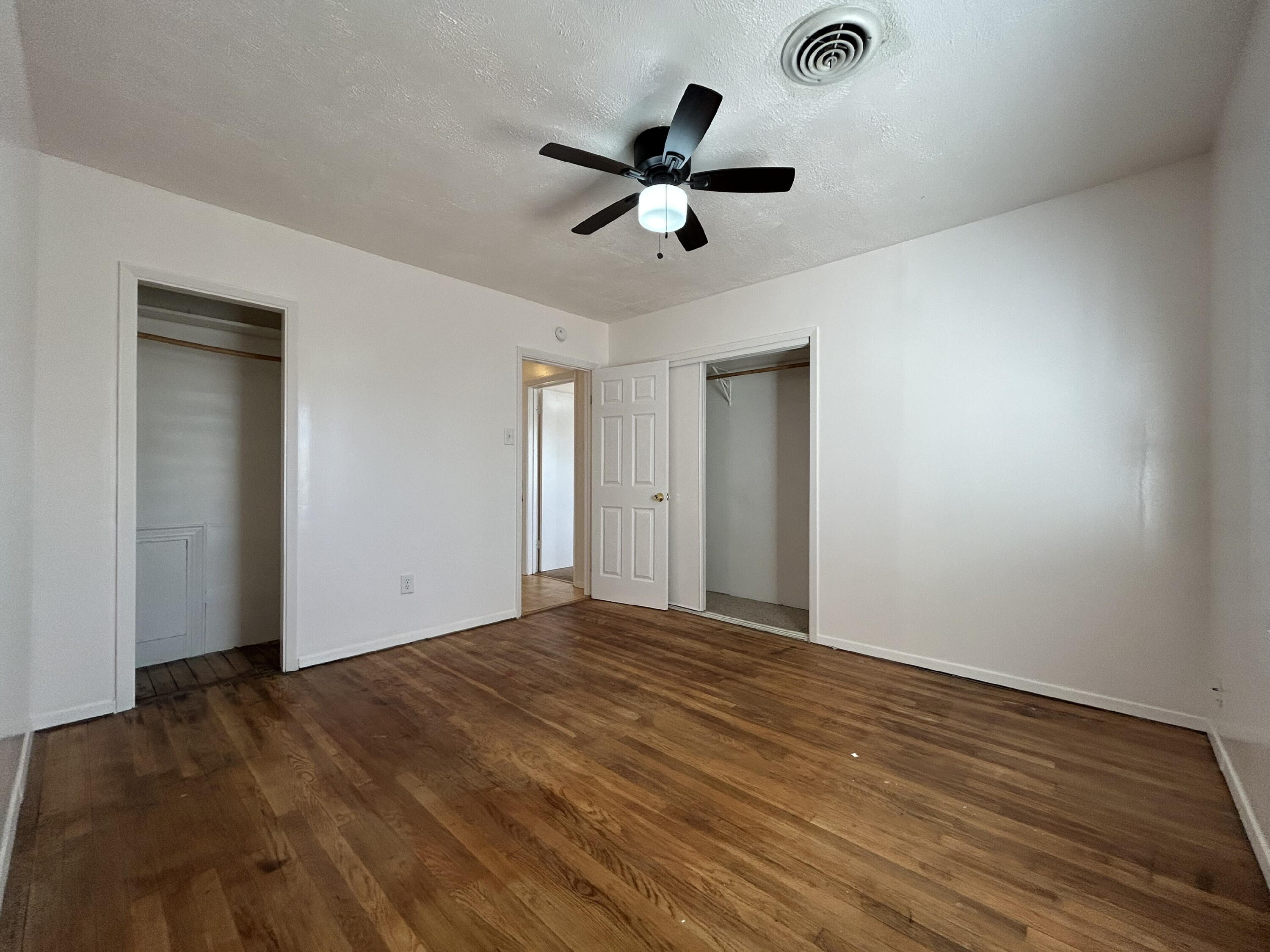 2201 28th Street, Unit FRONT Lubbock, TX 79411 - Photo 21 of 23 a view of an empty room with a ceiling fan