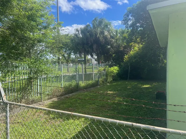 a view of backyard with tree