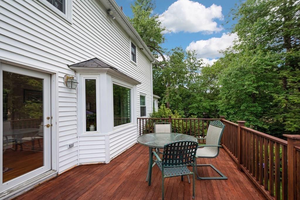35 Meadowbrook Road Needham, MA 02492 - Photo 26 of 32 a view of a house with wooden deck and furniture