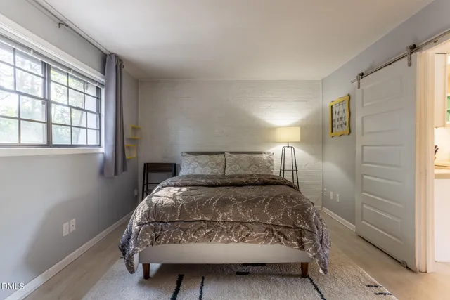 a bedroom with a bed and a television in it