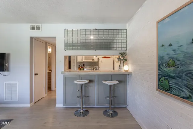 a room with a table and chairs