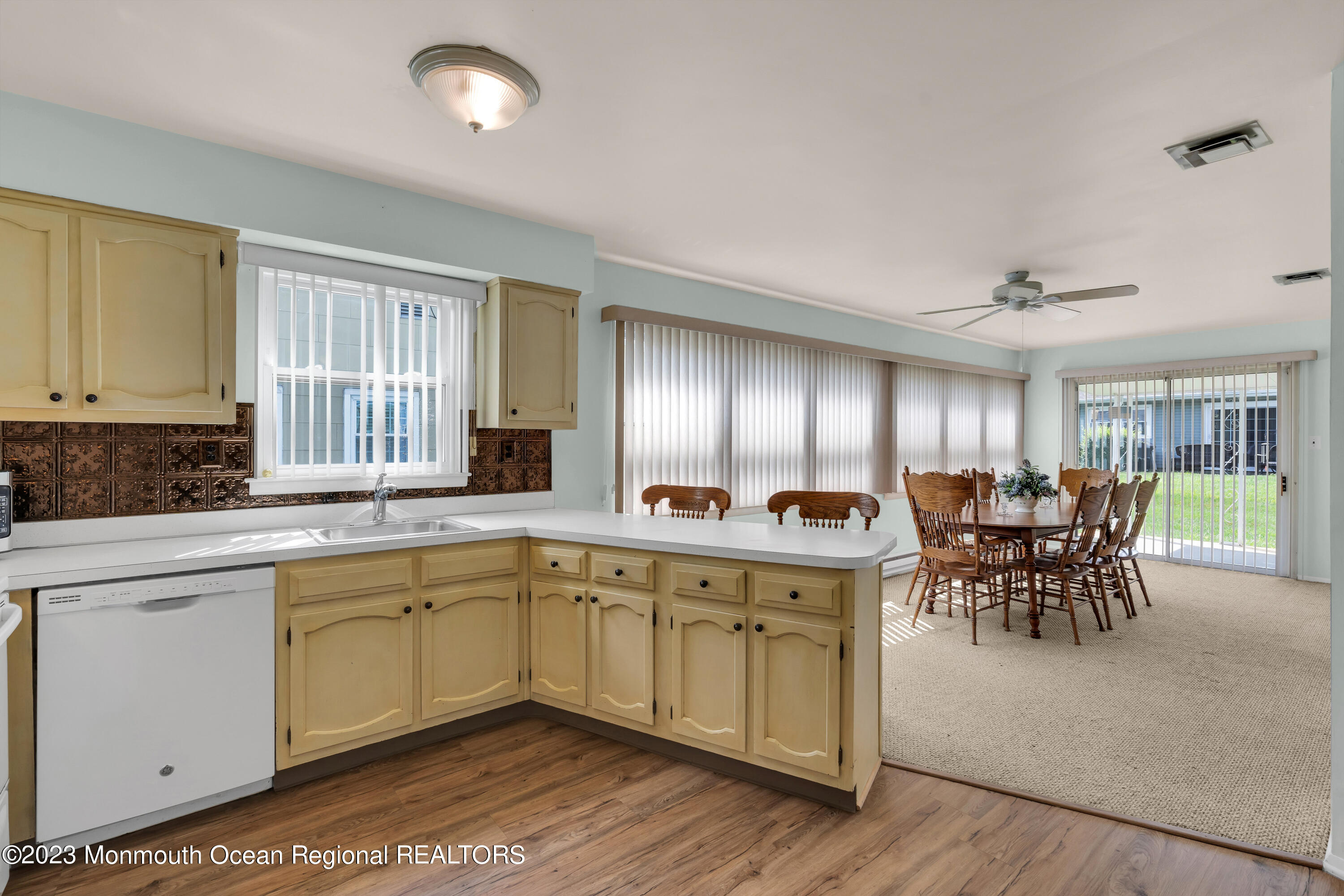 21 Blake Circle Brick, NJ 08724 - Photo 11 of 23 a large kitchen with a table and chairs
