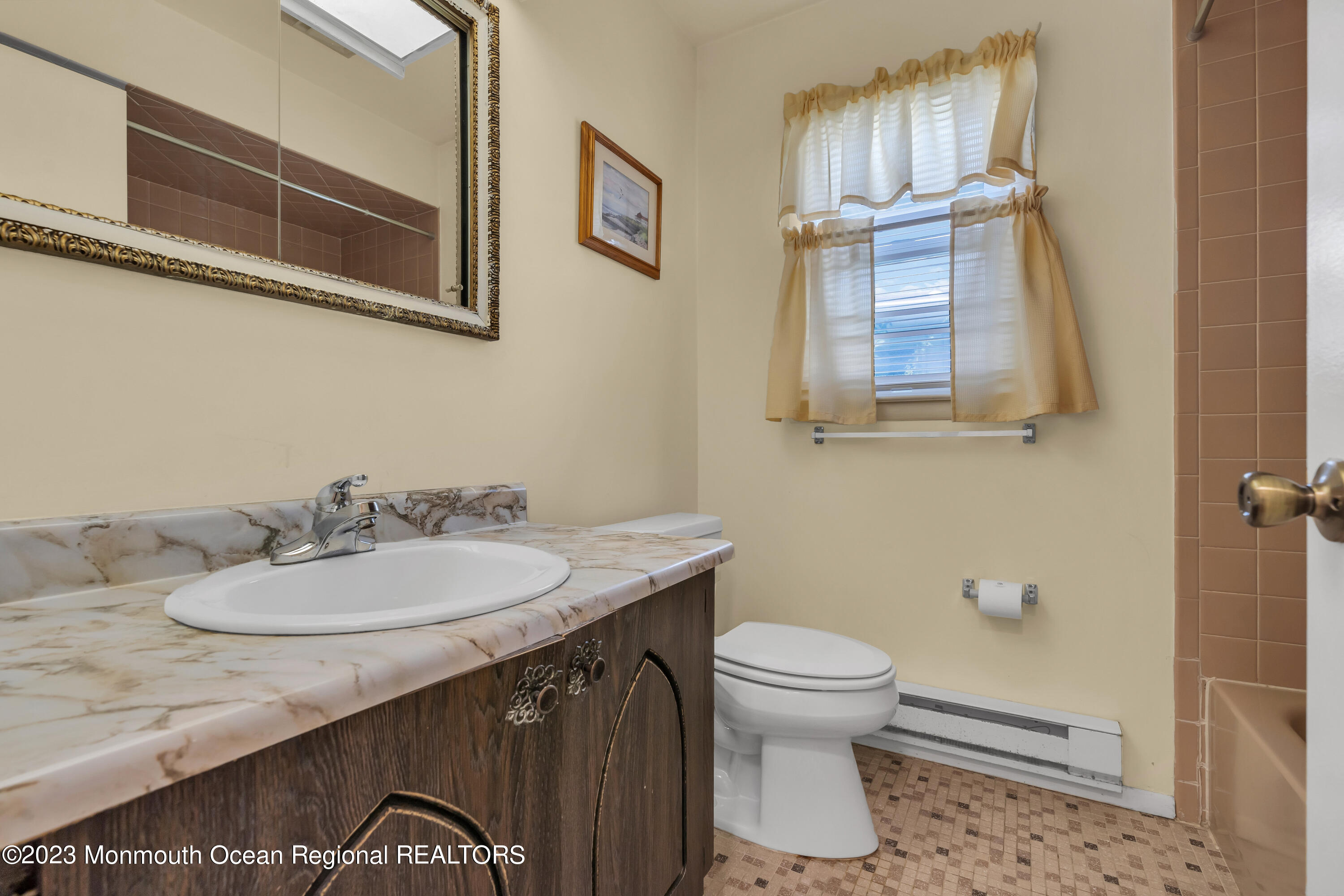 21 Blake Circle Brick, NJ 08724 - Photo 17 of 23 a bathroom with a sink a toilet and mirror