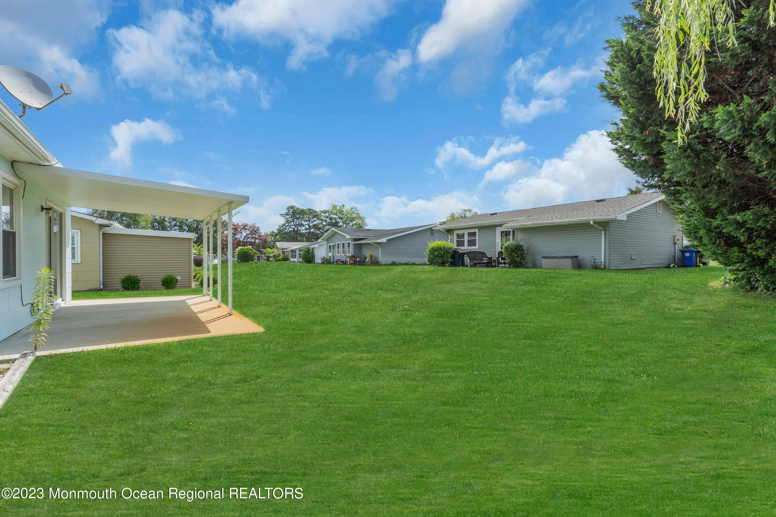 21 Blake Circle Brick, NJ 08724 - Photo 22 of 23 a view of an house with backyard porch and garden