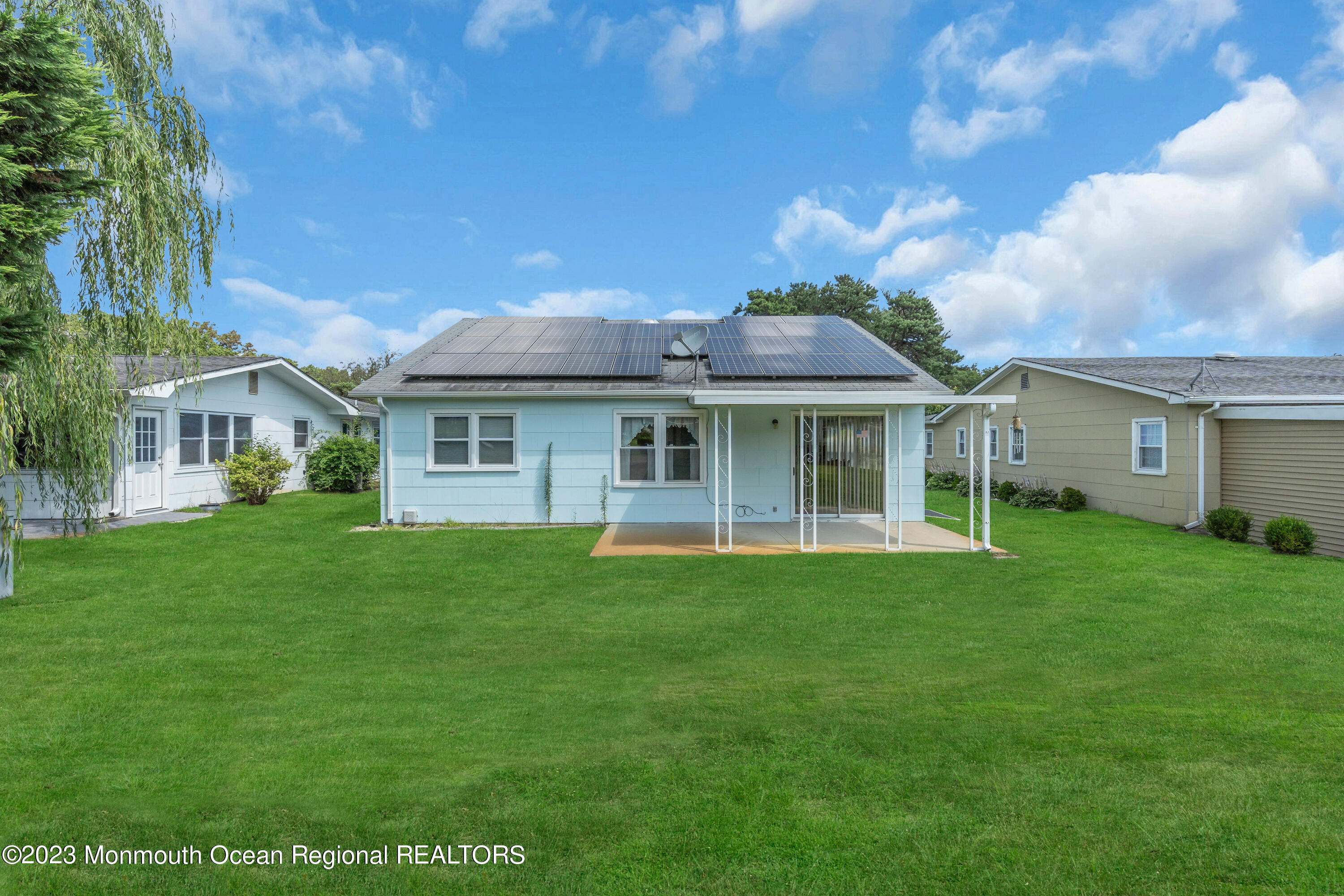 21 Blake Circle Brick, NJ 08724 - Photo 23 of 23 a front view of a house with a garden