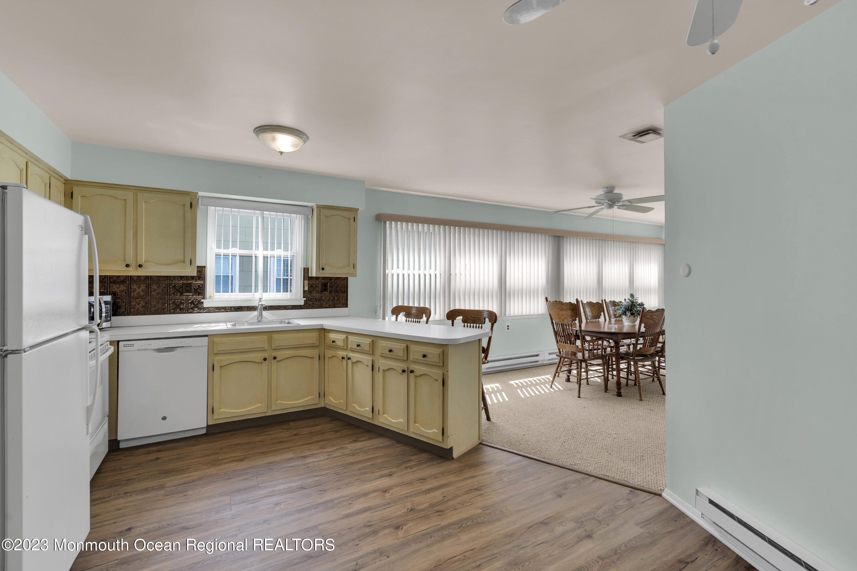 21 Blake Circle Brick, NJ 08724 - Photo 10 of 23 a kitchen with sink cabinets and table chair