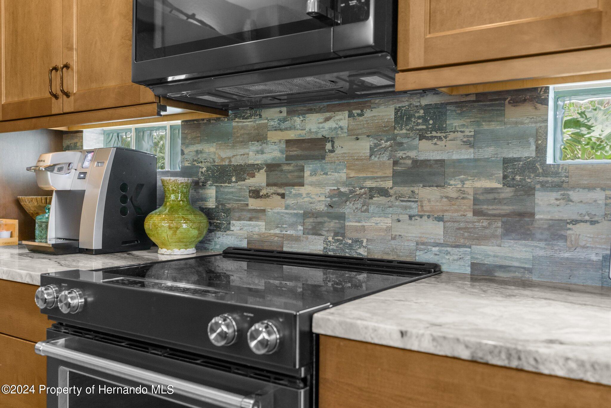 8075 Delaware Weeki Wachee, FL 34607 - Photo 60 of 96 a close view of stove