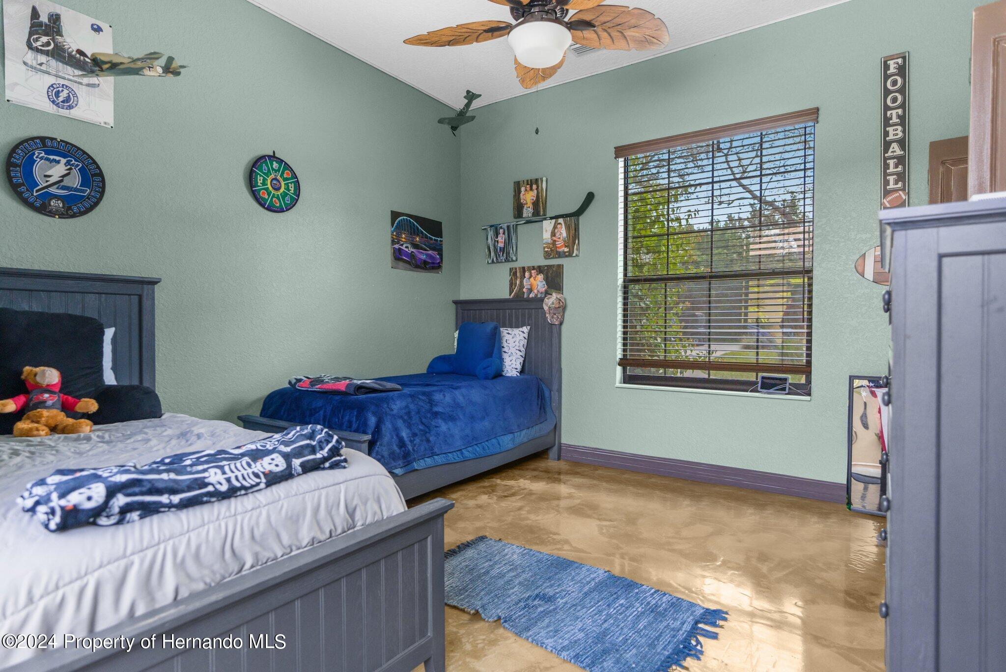 8075 Delaware Weeki Wachee, FL 34607 - Photo 83 of 96 a bedroom with a bed and a window