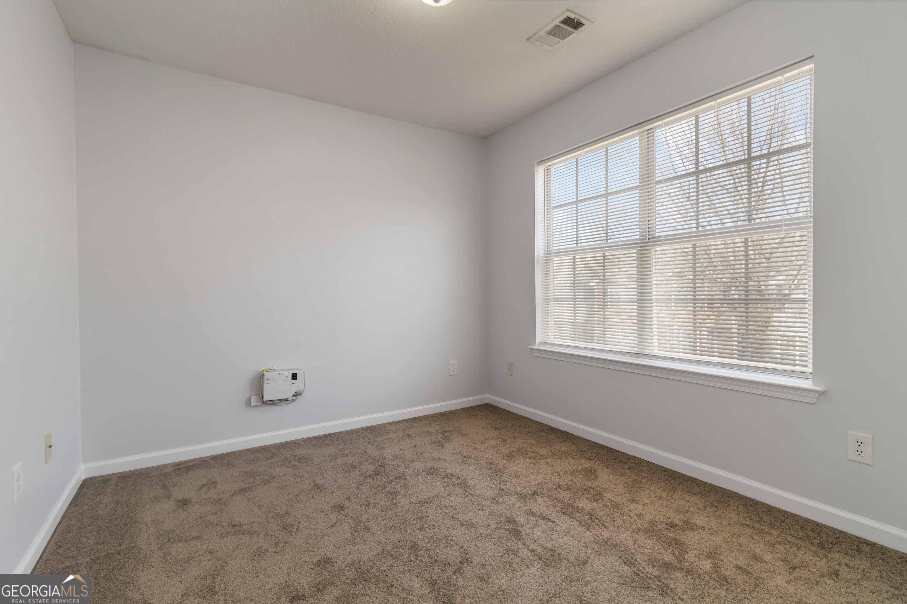 11307 Michelle Way Hampton, GA 30228 - Photo 18 of 30 an empty room with a window