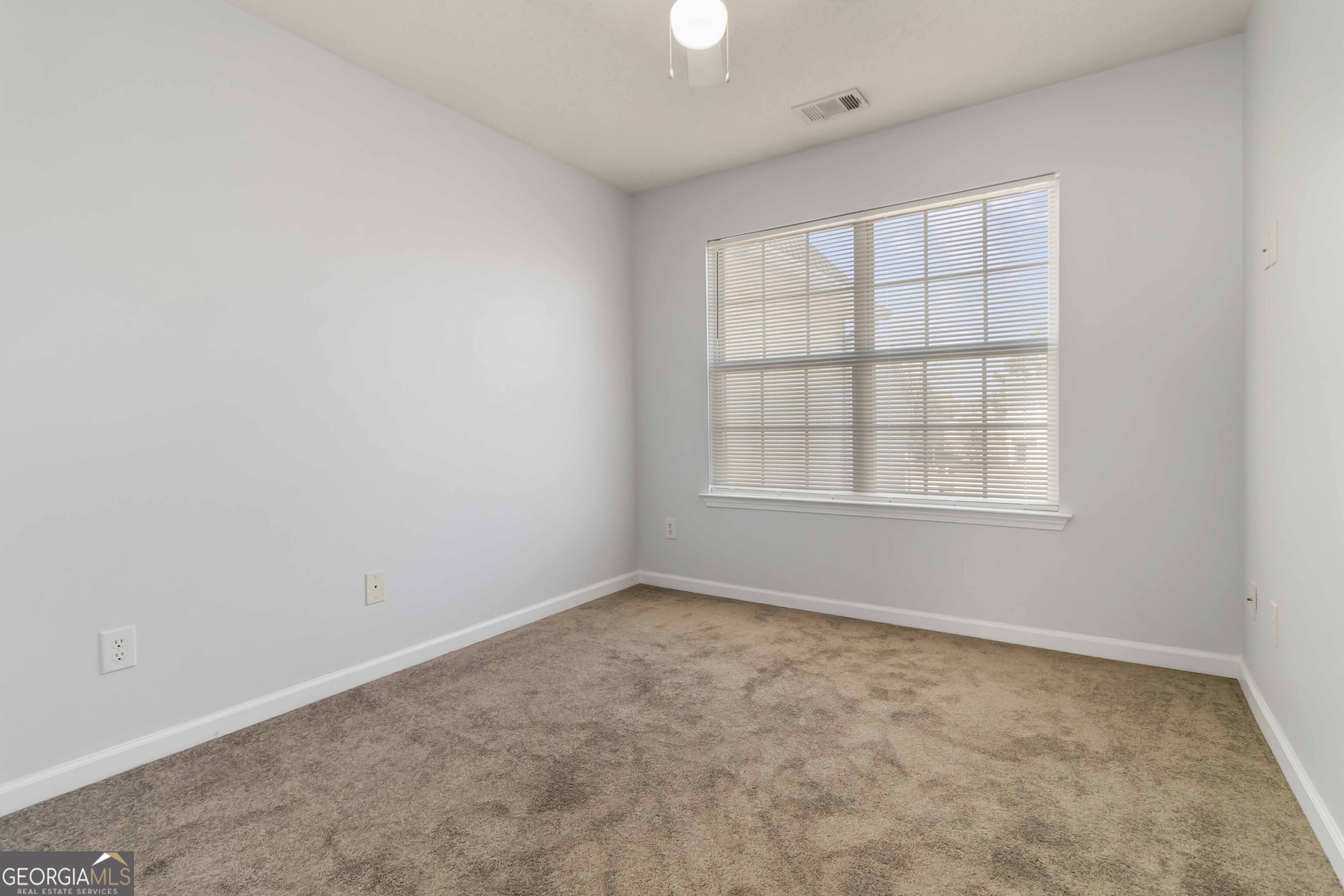 11307 Michelle Way Hampton, GA 30228 - Photo 20 of 30 an empty room with a window