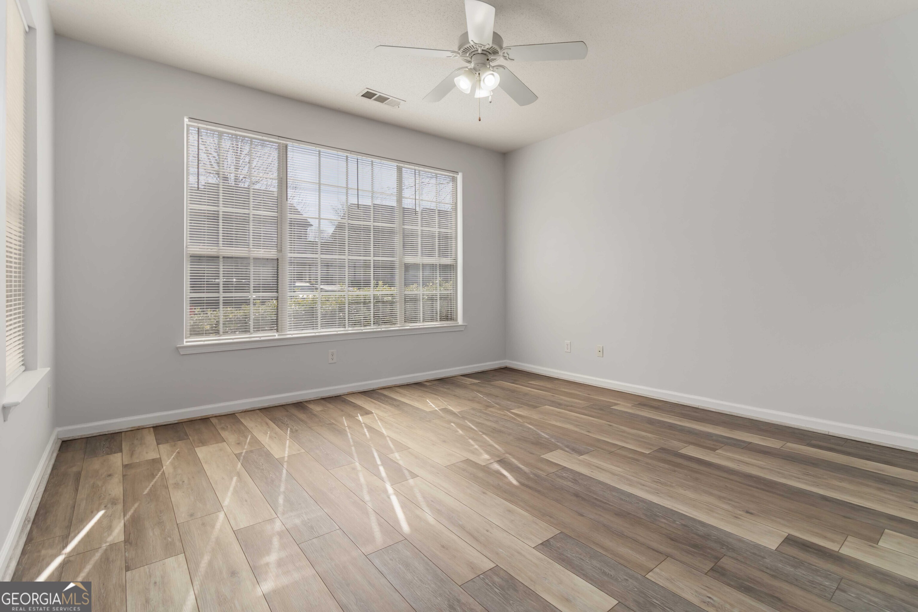 11307 Michelle Way Hampton, GA 30228 - Photo 7 of 30 a view of an empty room with a window